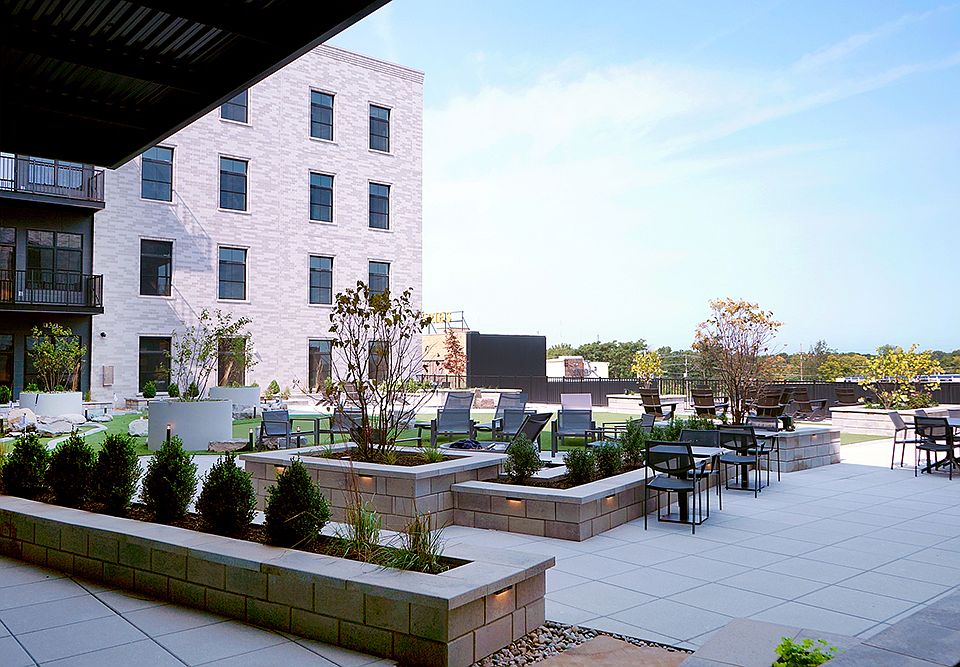 4th floor rooftop area w/ grills, 2 fire pits, putting greens and water feature!