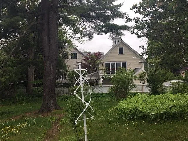 View of the carriage house from the neighbor's gardens.