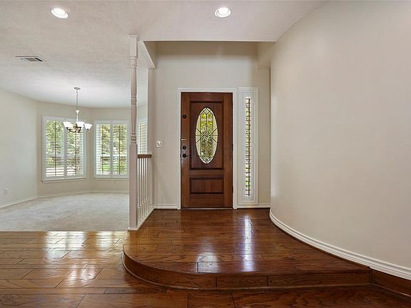 This inviting entry used for greeting your guests, is accented with a custom curved wall.