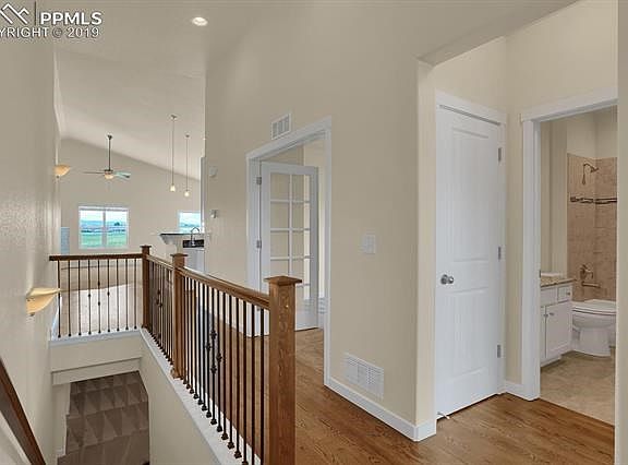 Spectacular Entry with Gleaming Hardwood Floors and High Vaulted Ceilings.