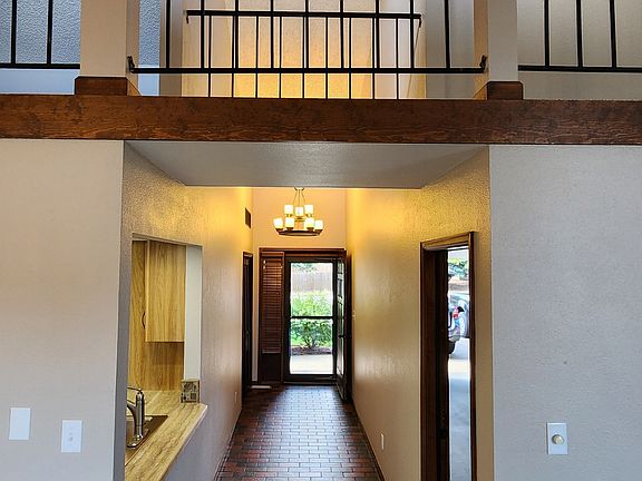 Entry way with balcony hall above it