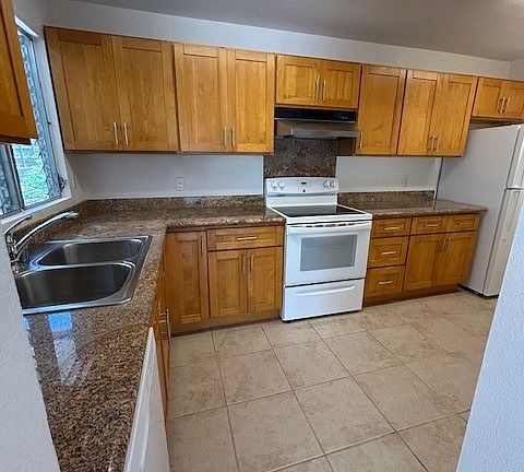 Kitchen with granite countertops and Maple cabinetry