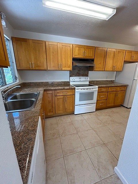 Kitchen with granite countertops and Maple cabinetry