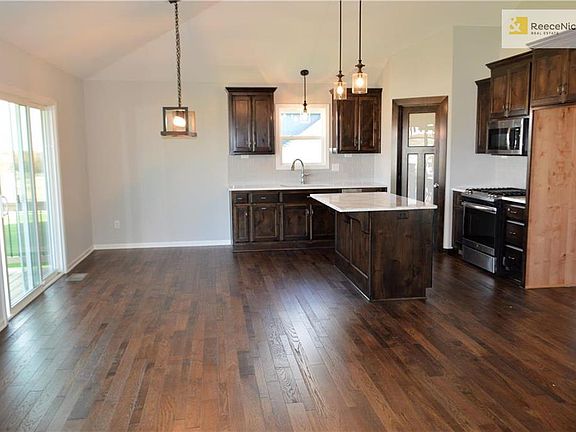 Another shot of kitchen showing pantry area door