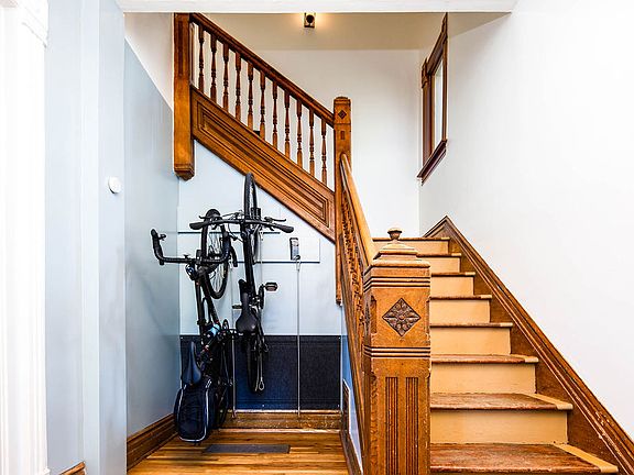 Share foyer with historic staircase and bicycle storage