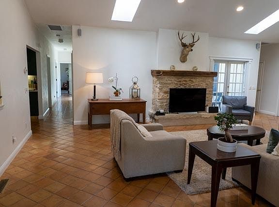 House is built in a U shape around an interior courtyard planted with lavender, rosemary and roses. The outside patio also has a fireplace.