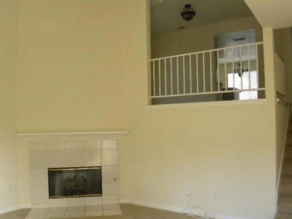 Spacious living room with a fire place.