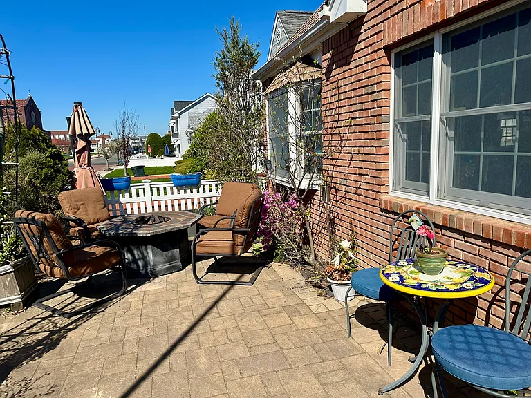 Fenced in Front yard with propane gas fireplace