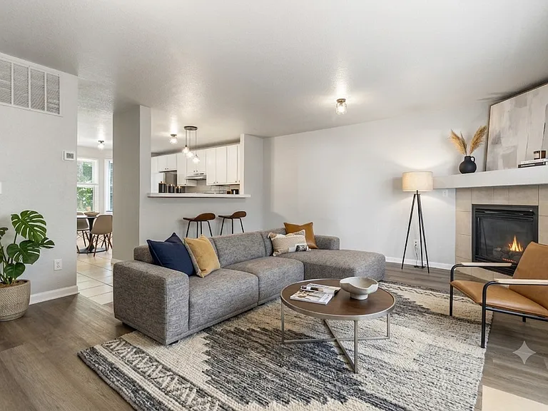 Family room with gas burning fireplace. (Furnishings for illustrative purposes only, not included.)