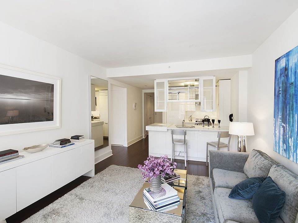 Open living spaces let in lots of natural light from oversized windows