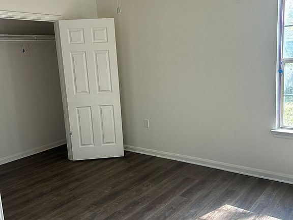 Primary bedroom with large walk-in closet.