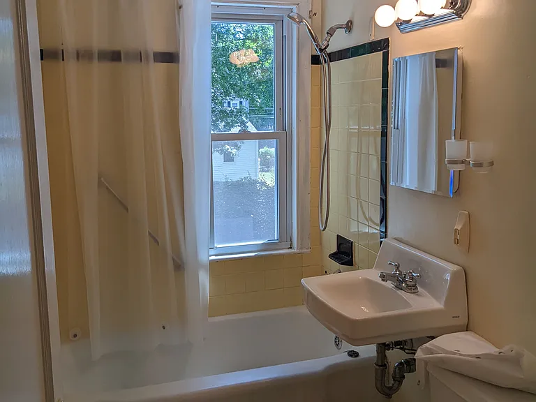 Full bathroom with large linen closet