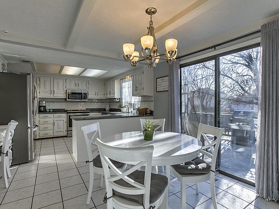 The eat-in kitchen has great windows onto the sunny deck.