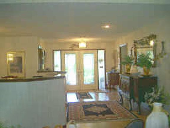 Double door entry leads into foyer