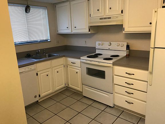 Kitchen, ceramic tile floor and new dishwasher.
