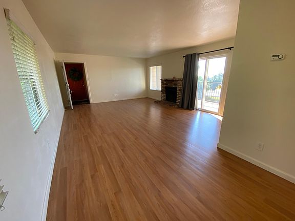 Spacious Living Room & dining area with fireplace and balcony