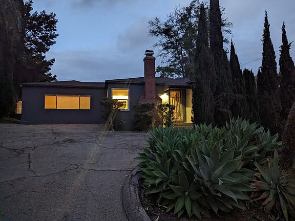 Long window is family room or master bedroom, living room is to the left of the front door.