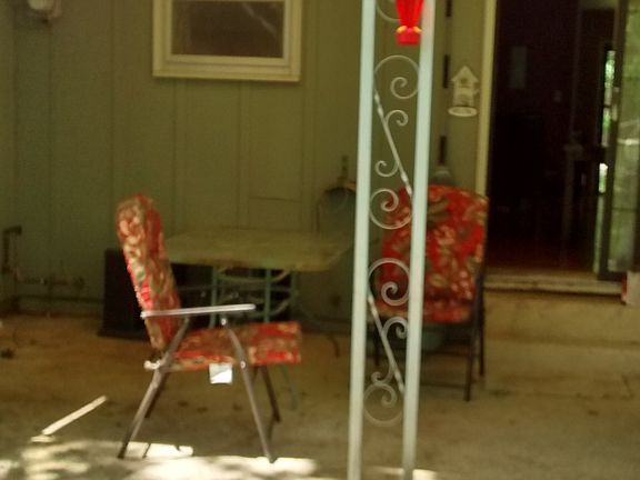 Back view with covered patio