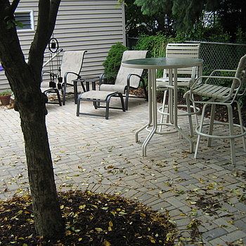 Brick paver patio and garage parking in the back