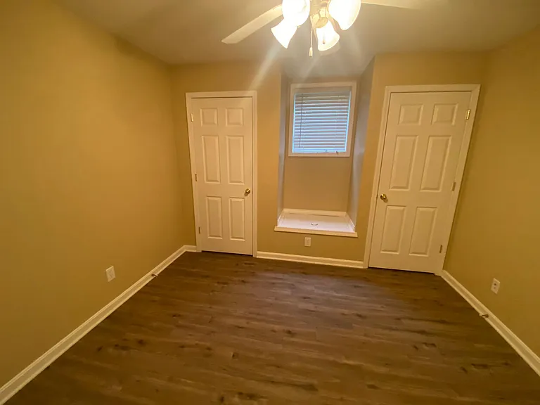 Guest bedroom. Lots of storage and adorable window seat.
