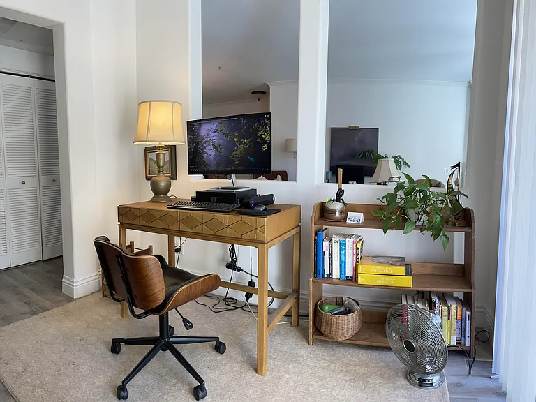 Washer and dryer are behind the louvered doors in the hallway to the left. No small bookcase as we added a wall unit.