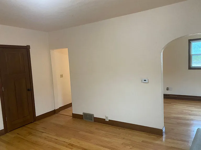 LIVING ROOM LOOKING TO DINING ROOM AND ENTRY TO KITCHEN
