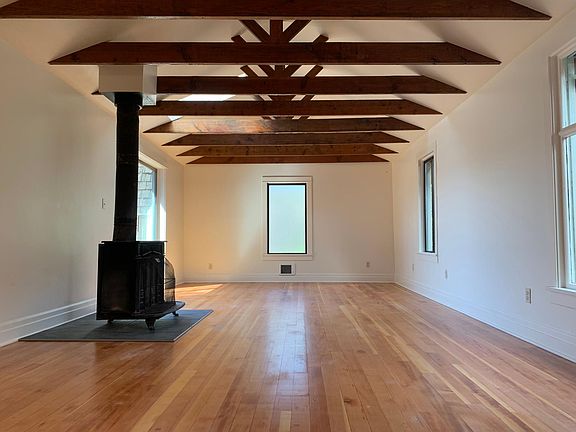 Living room, wood burning stove, high vaulted ceilings