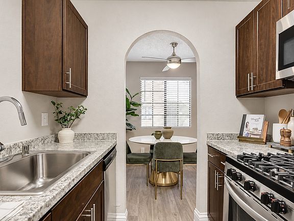 Step into the chef's delight of Diamondhead, where modern appliances meet elegant finishes. The seamless flow from the kitchen to the inviting dining area creates a perfect space for relaxation and entertaining. Take the next step toward your new home tod