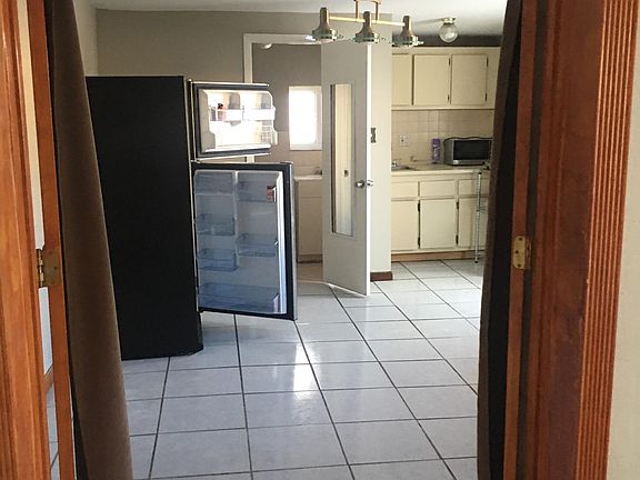 View from bedroom of living/ kitchen/bathroom