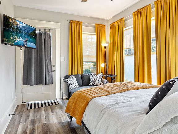 Master Bed / Living Space with adjustable Wall Mounted TV
