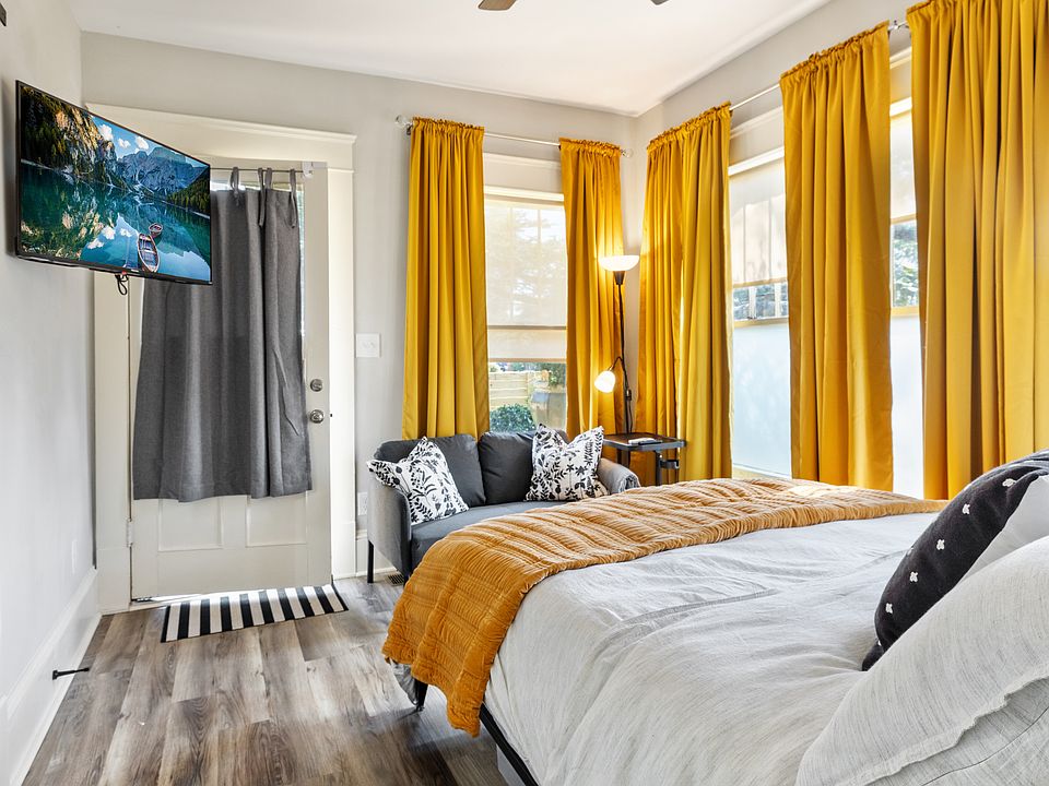 Master Bed / Living Space with adjustable Wall Mounted TV