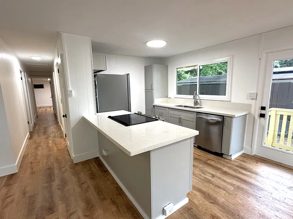 Kitchen and view of hallway to bedrooms