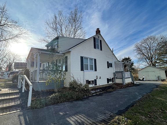 Paved driveway with room for several cars. Brick walkways lead to front and back porches. Garage in picture is off-limits to tenants.