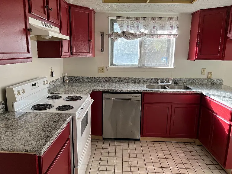 Kitchen view with new base cabinet and beautiful maroon color.