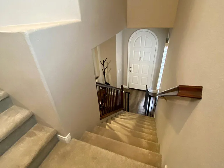 Stairs leading down to front door