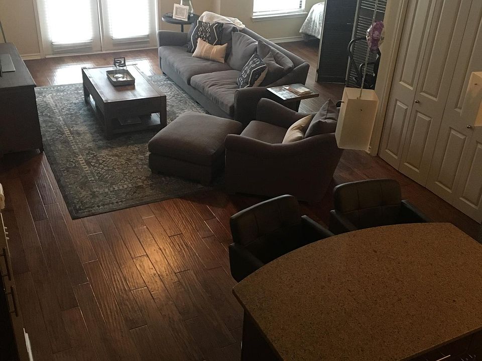 Living room / Kitchen.  Balcony looks East 