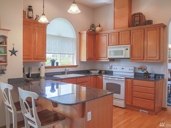 Open concept kitchen with lazy susan and pull outs in the cabinets, no detail left out!