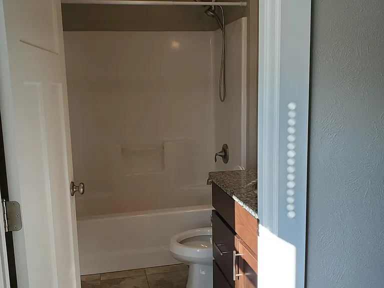 Upper bedroom bath. Radiant heat in beneath tile flooring.