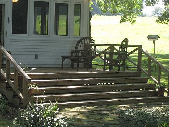 Inviting back deck welcomes you home to this charming classic bungalow.