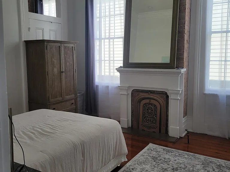 Bedroom #1 with writing desk, armoire, dresser