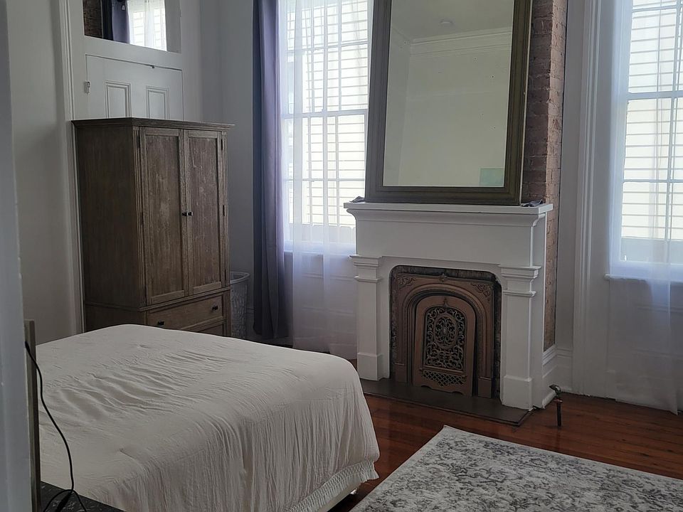 Bedroom #1 with writing desk, armoire, dresser
