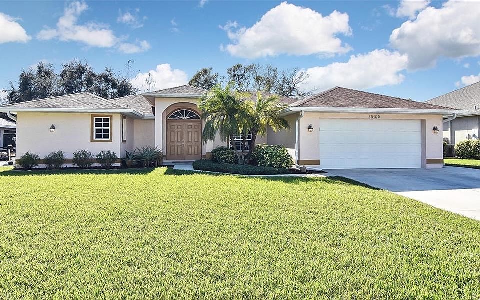 Inviting, custom pool home with a lake & preserve view on city water & sewer.