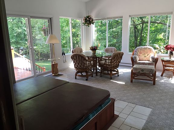 Sunken hot tub in sunroom