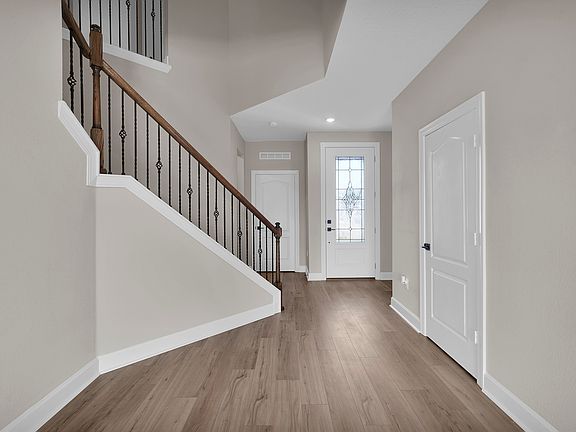 The entryway welcomes you with style, setting a warm tone for the rest of the home.