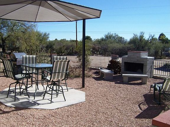 Back patio with outdoor fireplace