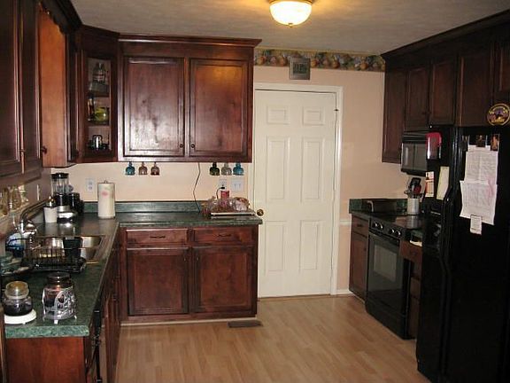 Kichen has Cherry Cabinets, pantry, appliances included!