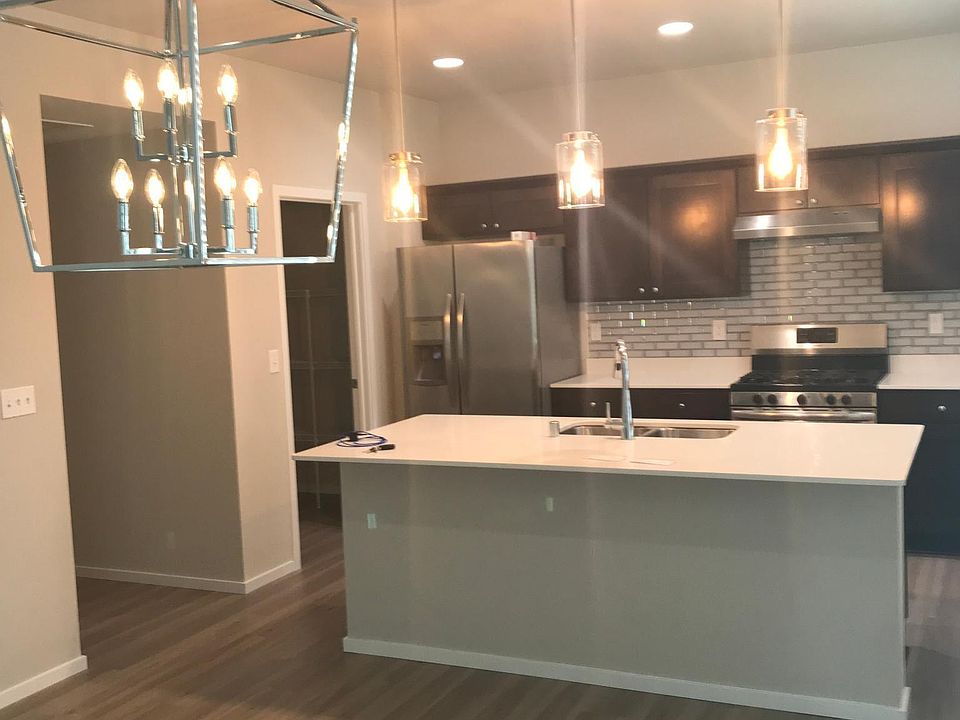 Open kitchen and dining room. In left side corner is walk-in pantry