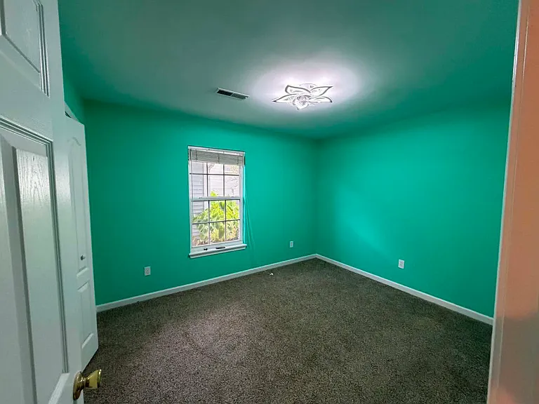 Bedroom 1, great as a child's room/in-home office space, remote controlled ceiling fan