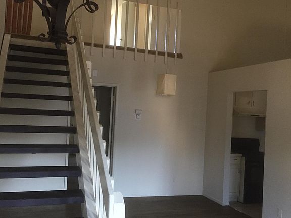 front entrance to dining room & living room with volume ceiling