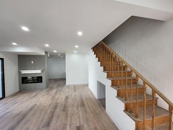 Living room with stairs to upstairs bedrooms